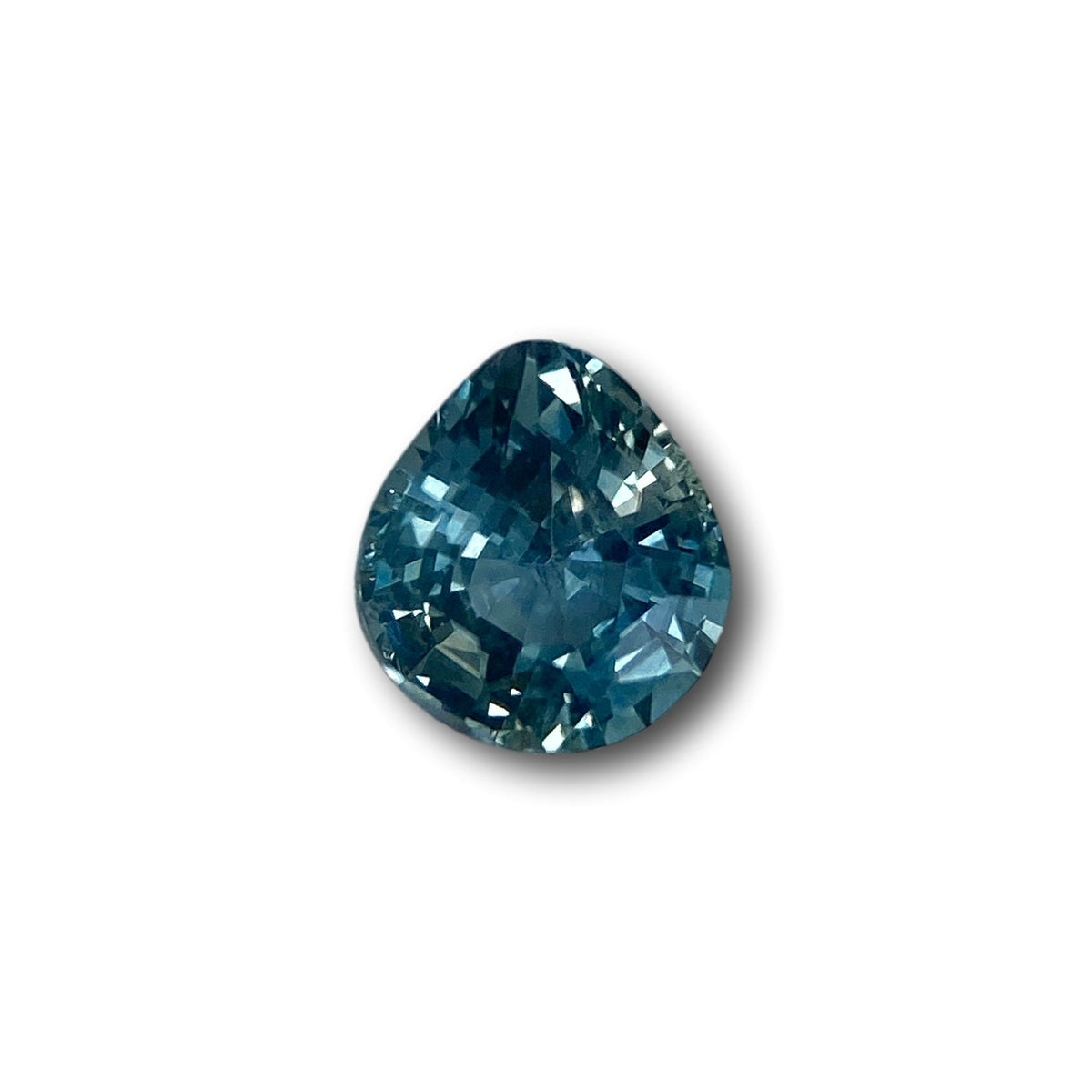 0.98ct pear-shaped blue Montana sapphire with a brilliant cut, measuring 6.30 x 5.60 x 3.80 mm on a white background.