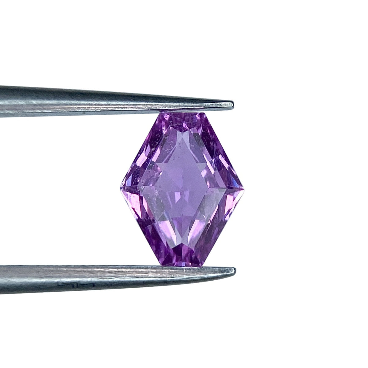 1.00ct brilliant cut lozenge-shaped violet sapphire held in metal tweezers against a white background.