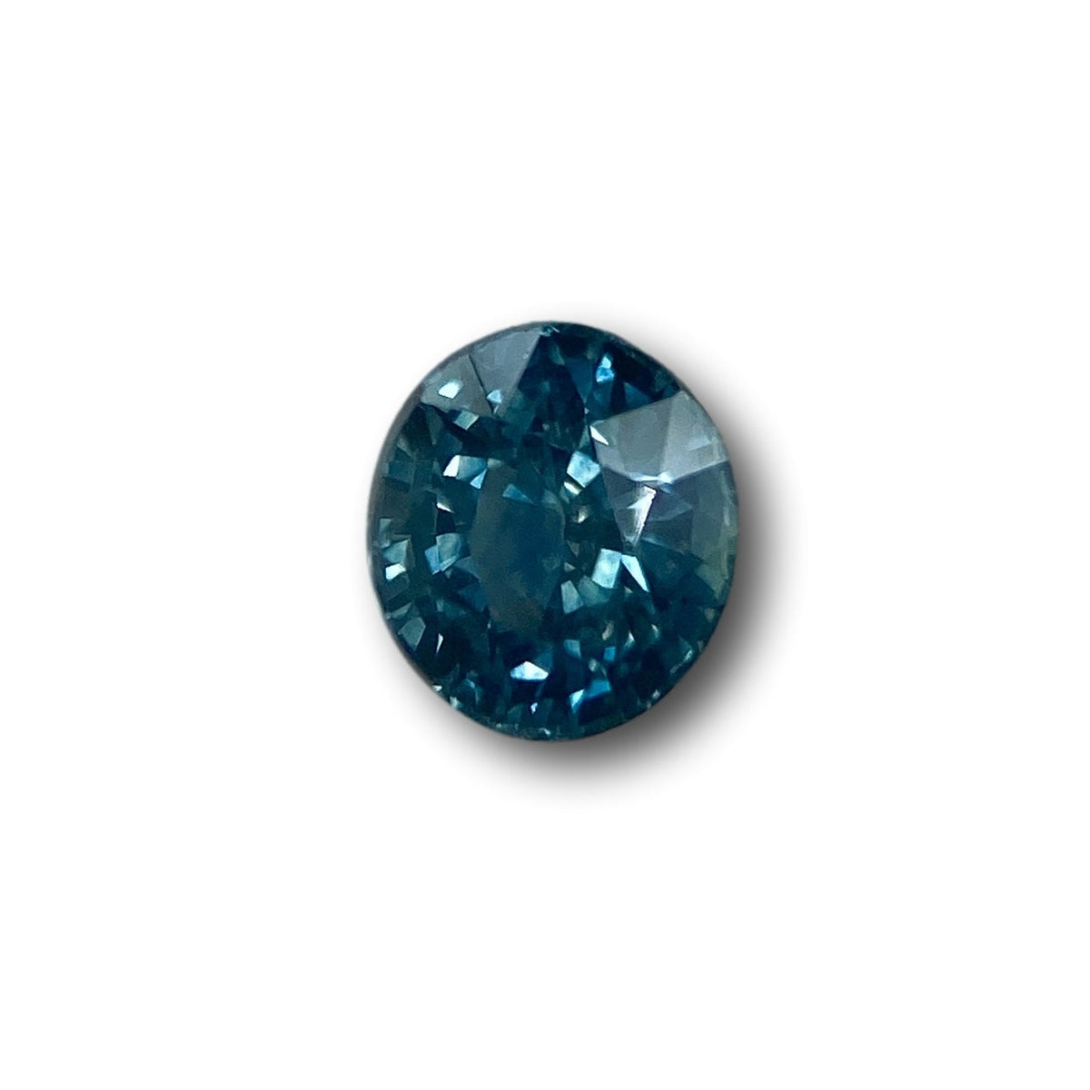 1.03ct oval brilliant cut blue Montana sapphire gemstone with deep facets.