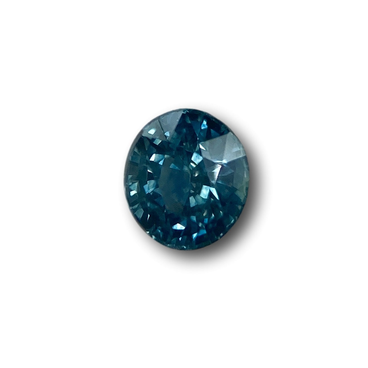 1.03ct oval brilliant cut blue Montana sapphire gemstone with deep facets.