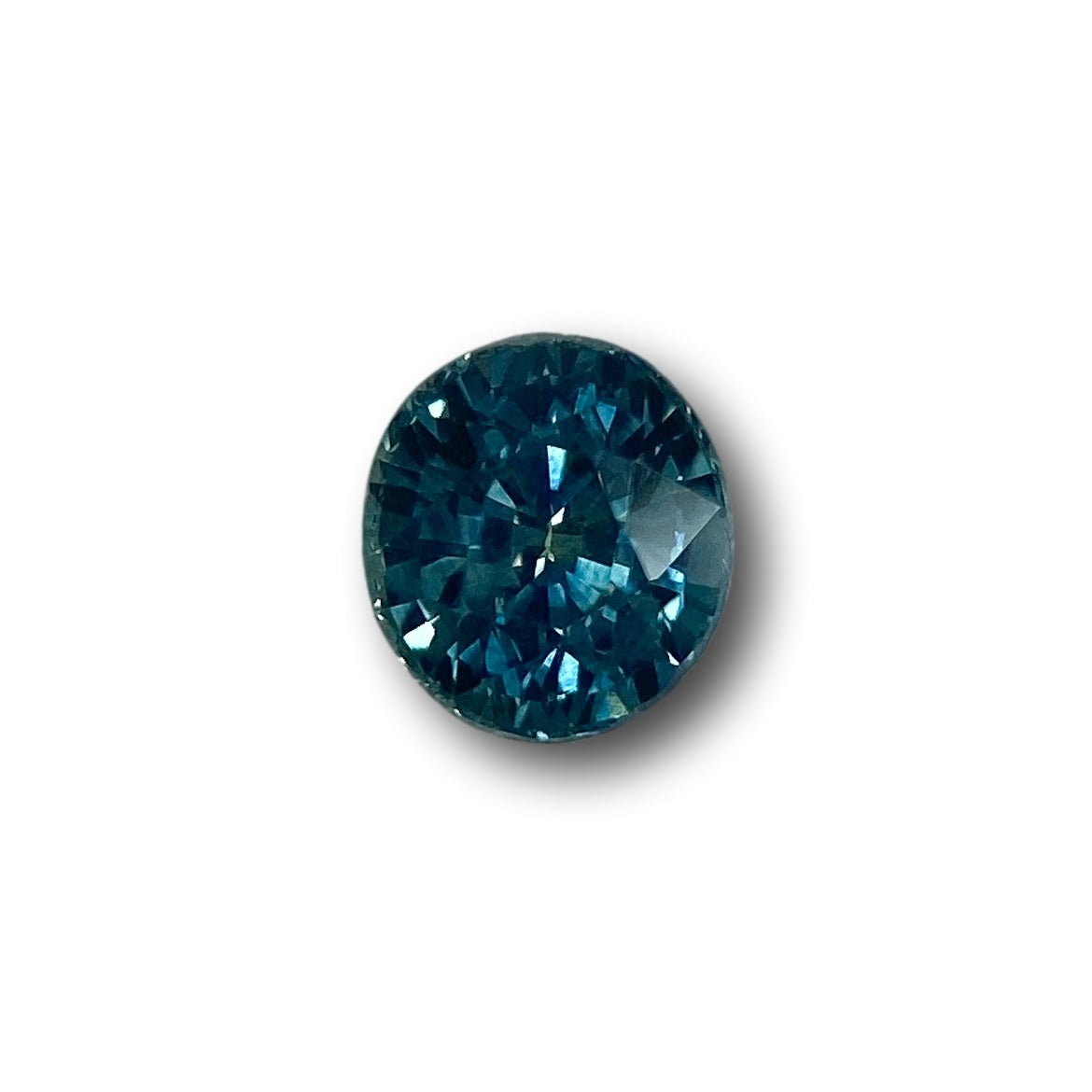 1.04ct oval brilliant cut blue Montana sapphire gemstone with deep facets.
