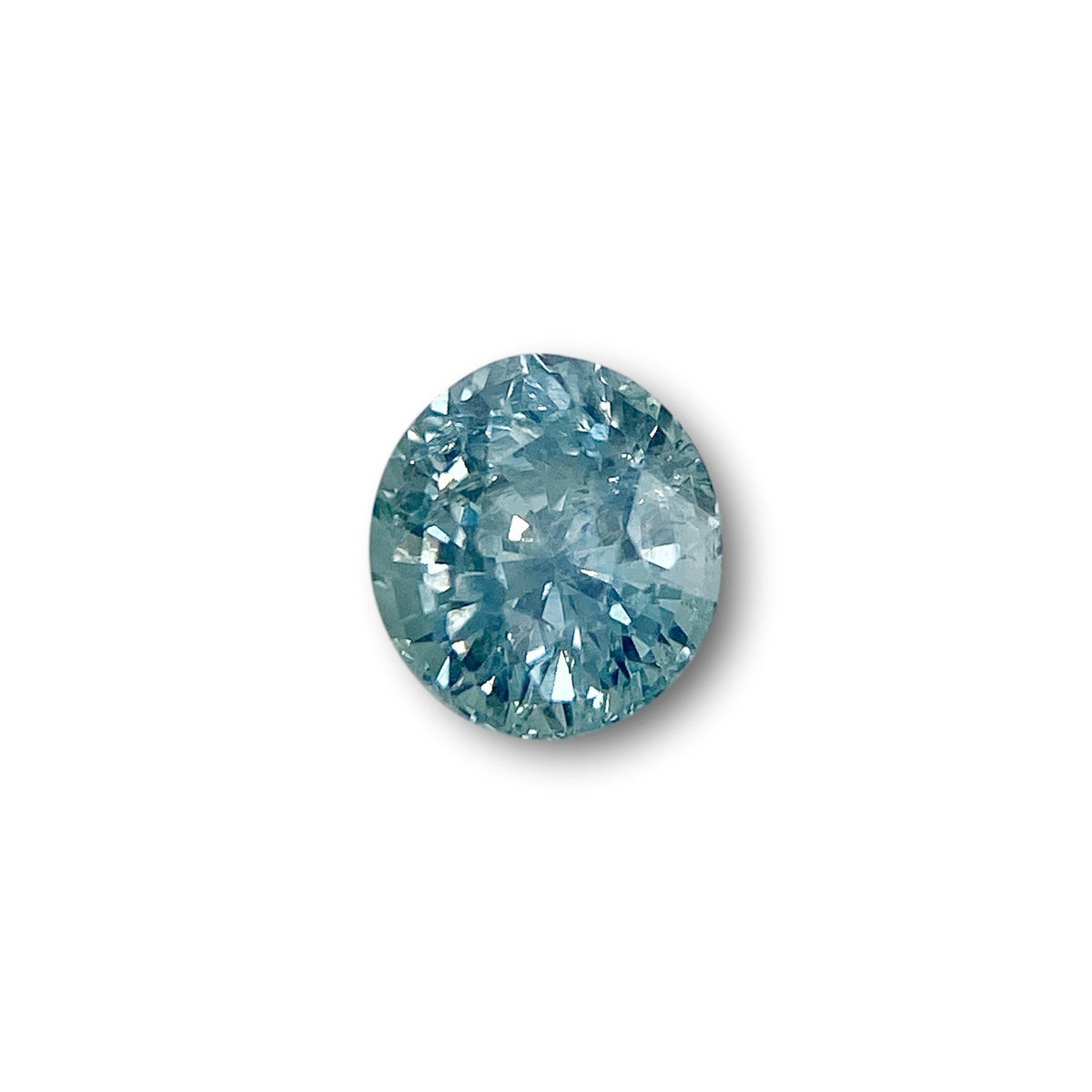 1.07ct oval brilliant cut blue Montana sapphire gemstone with sparkling facets on a white background.