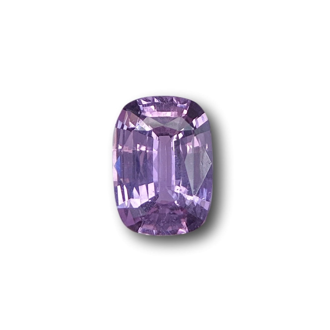 1.08ct brilliant cut cushion-shaped violet sapphire gemstone with faceted edges.