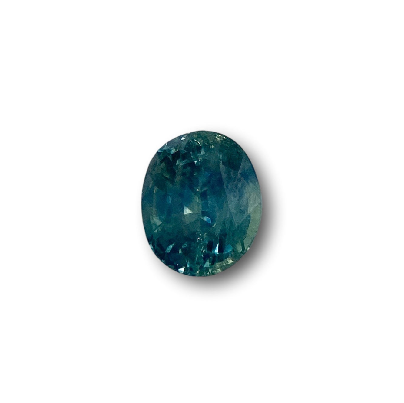 1.09ct oval brilliant cut blue Montana sapphire gemstone with faceted surface.