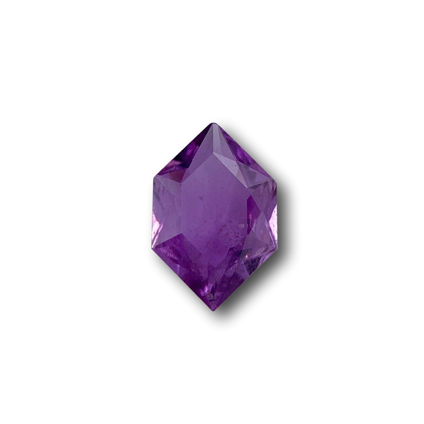 1.17ct brilliant cut violet sapphire in a unique hexagon shape against a white background.