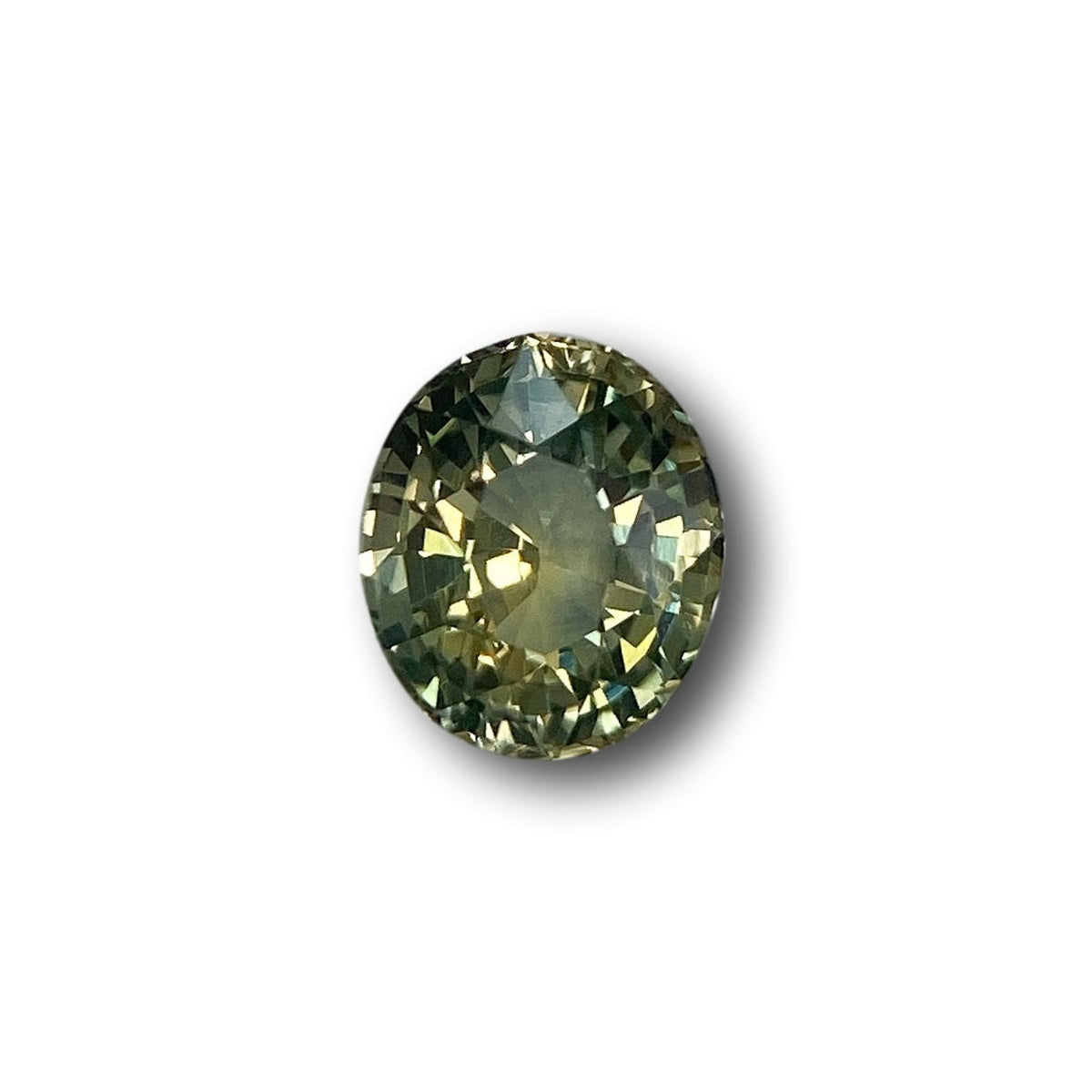 1.48ct oval brilliant cut green Montana sapphire gemstone with faceted surface and earthy olive tones.