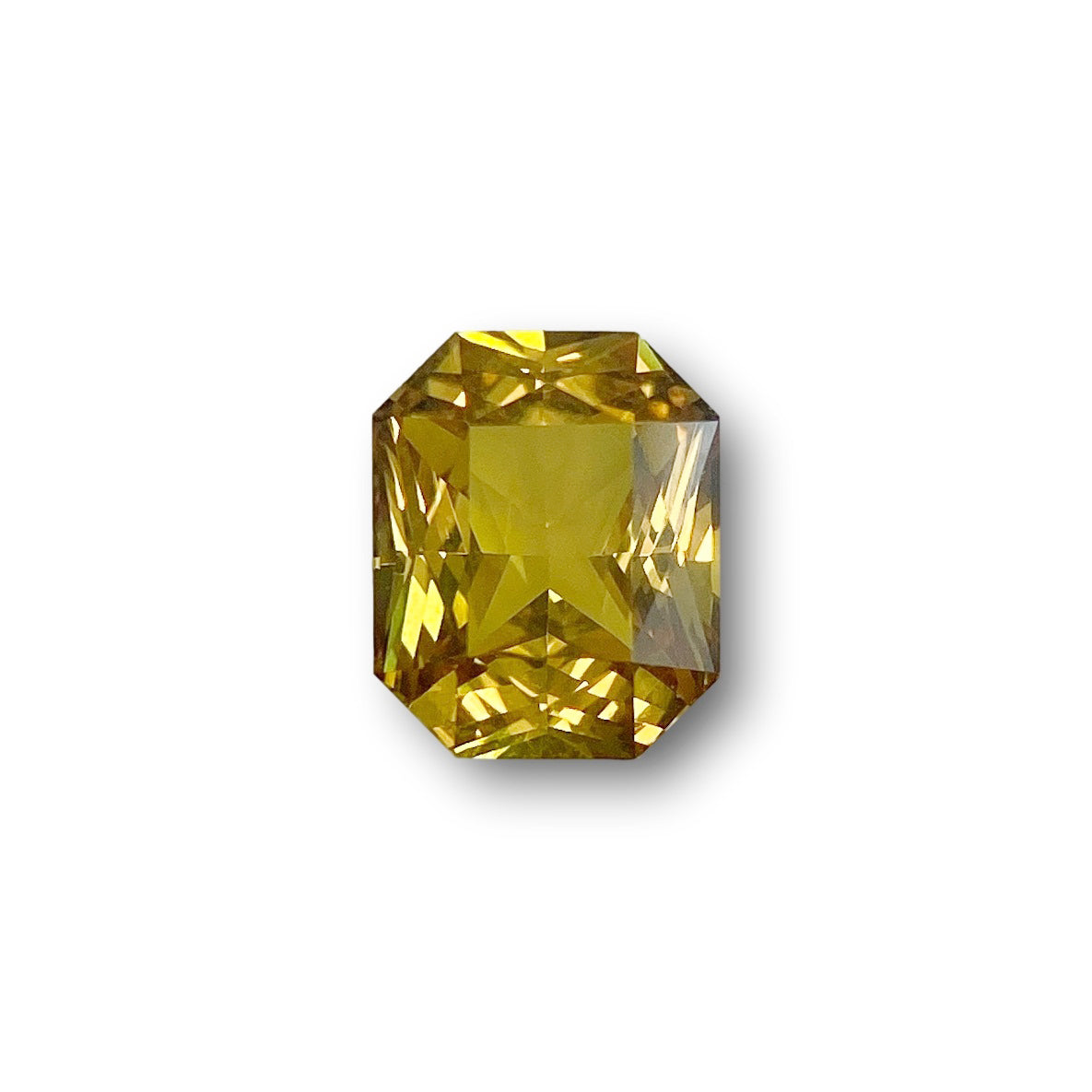 1.62ct radiant cut yellow sapphire gemstone with a brilliant faceted surface on a white background.