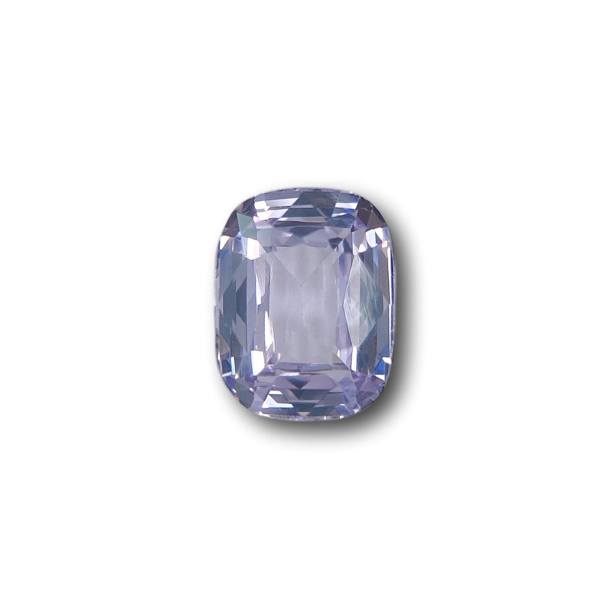 1.71ct cushion-cut blue spinel gemstone with brilliant facets isolated on a white background.