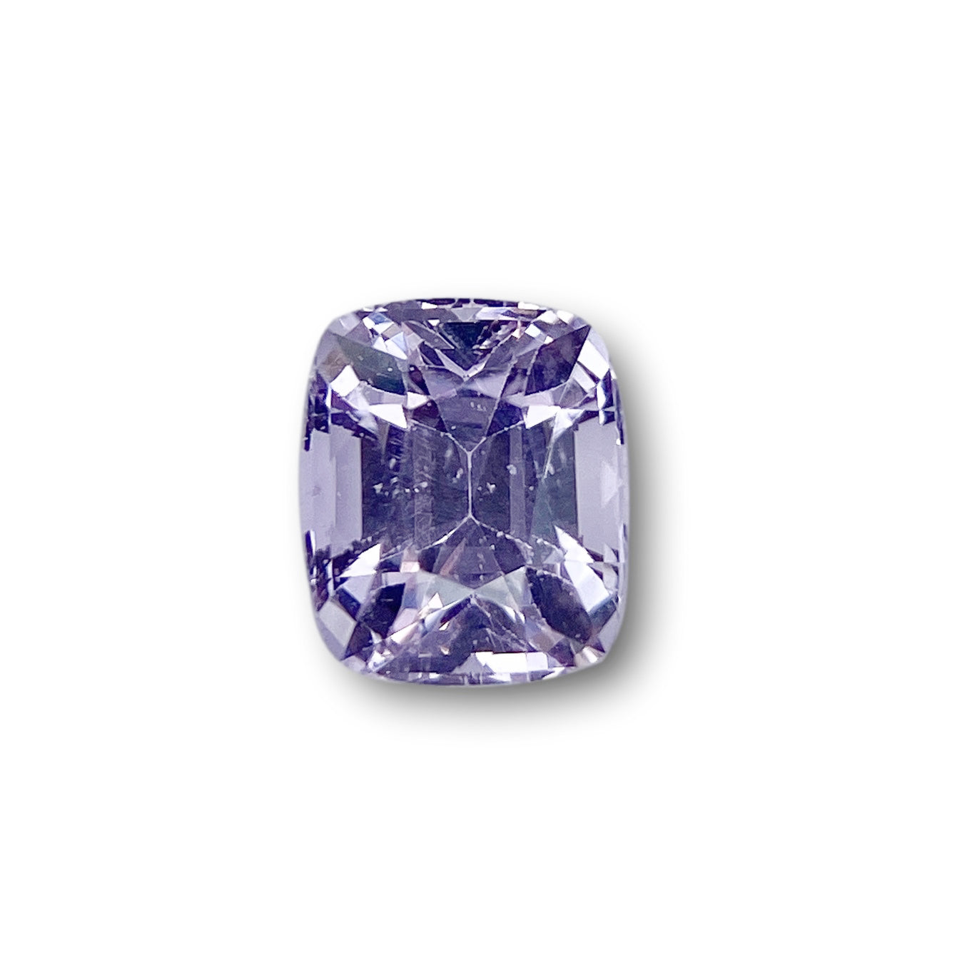 1.81ct cushion-cut purple sapphire with a brilliant facet pattern on a white background.