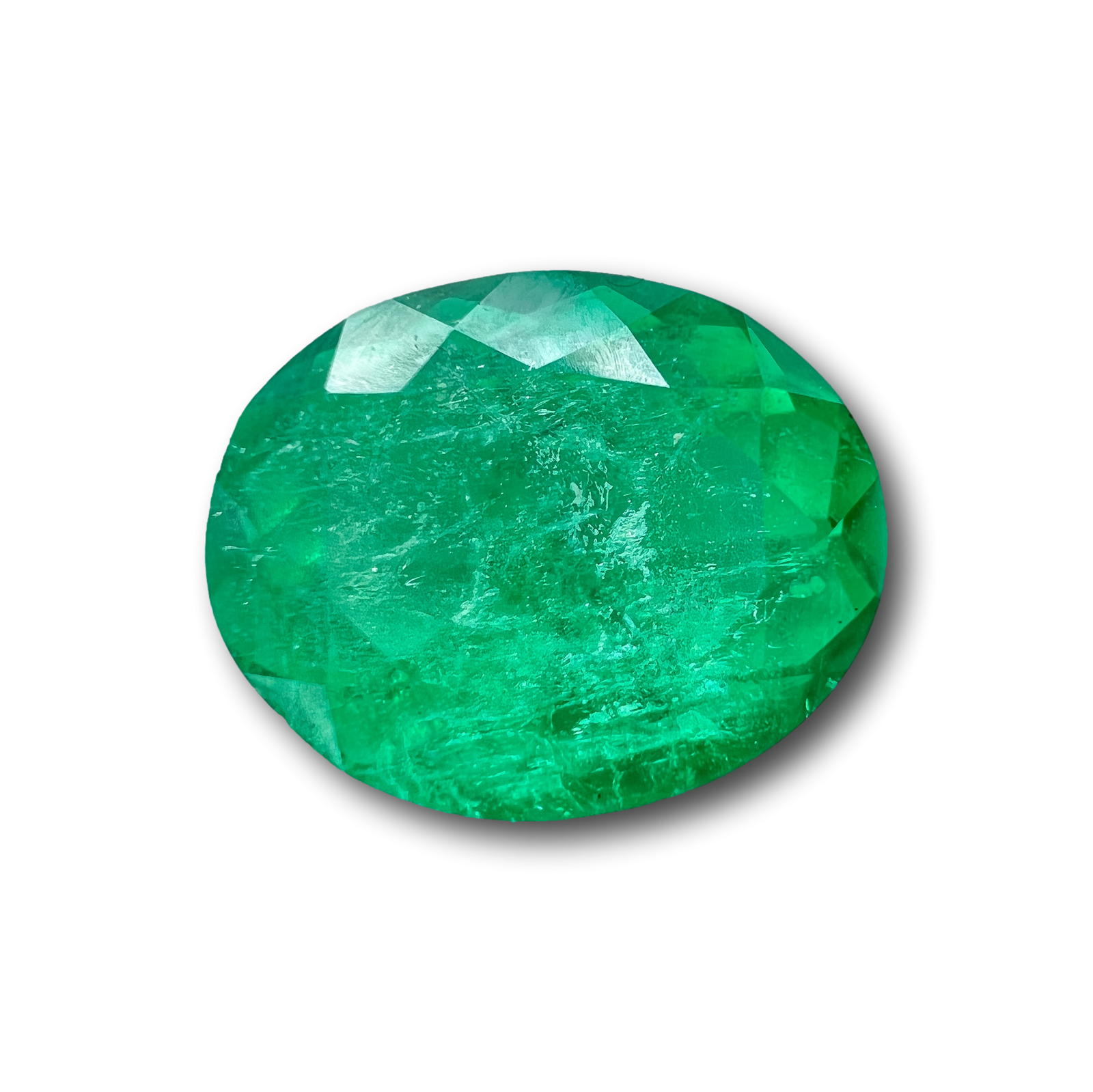 2.20ct oval brilliant cut Muzo emerald gemstone with a vibrant green color and faceted surface.