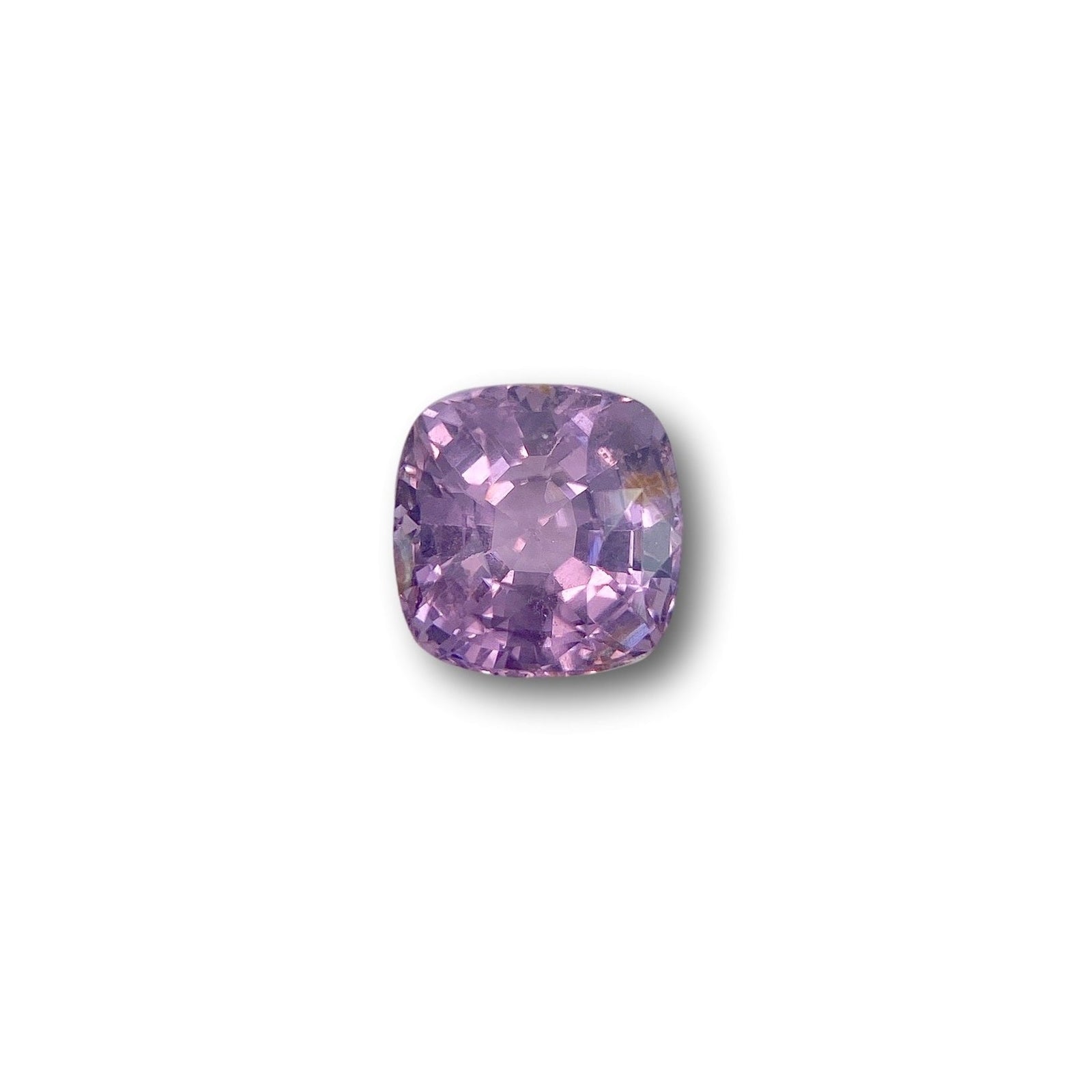 2.57ct cushion-cut violet spinel gemstone with a brilliant facet pattern on a white background.