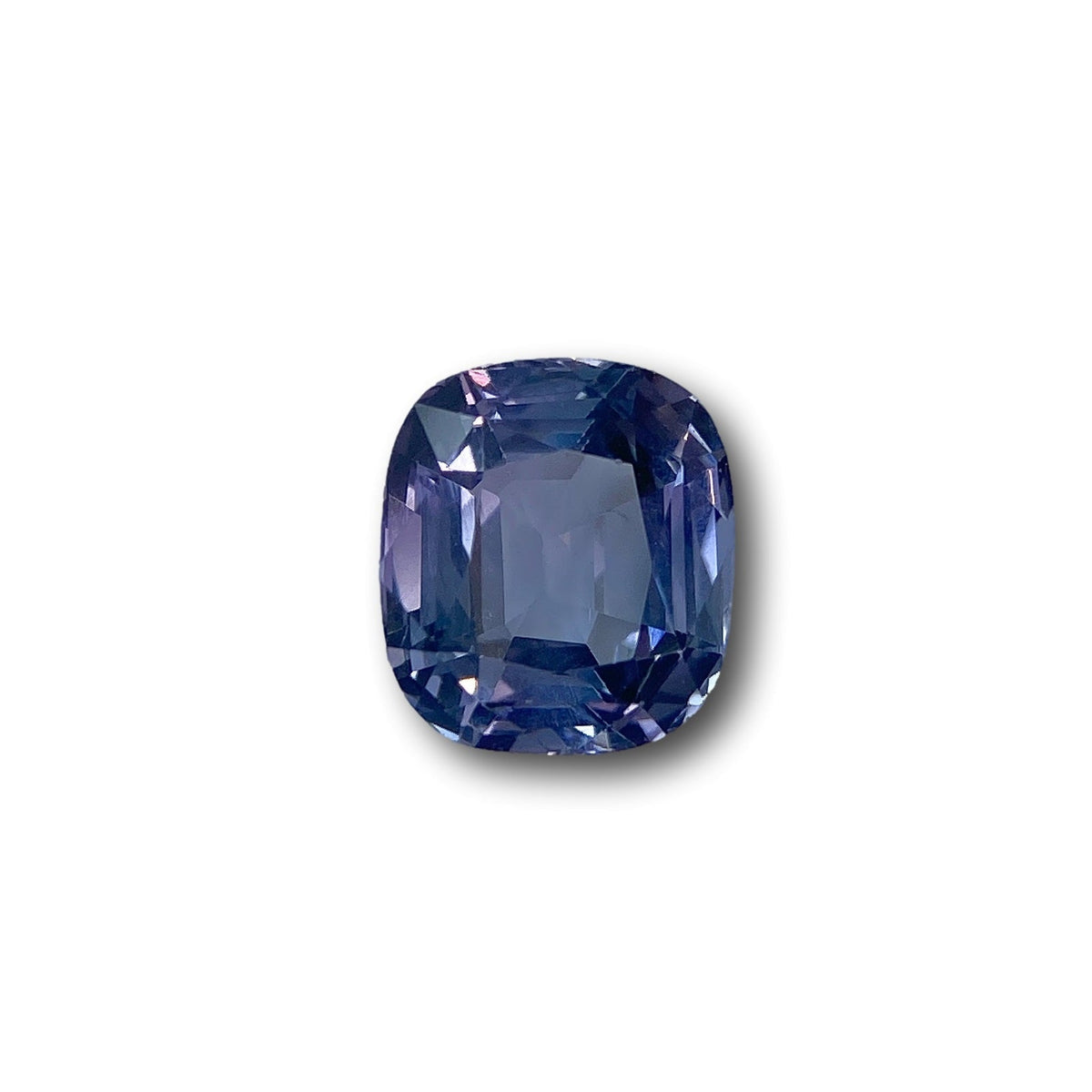 2.58ct cushion-cut purple spinel gemstone with a brilliant facet design, isolated on a white background.