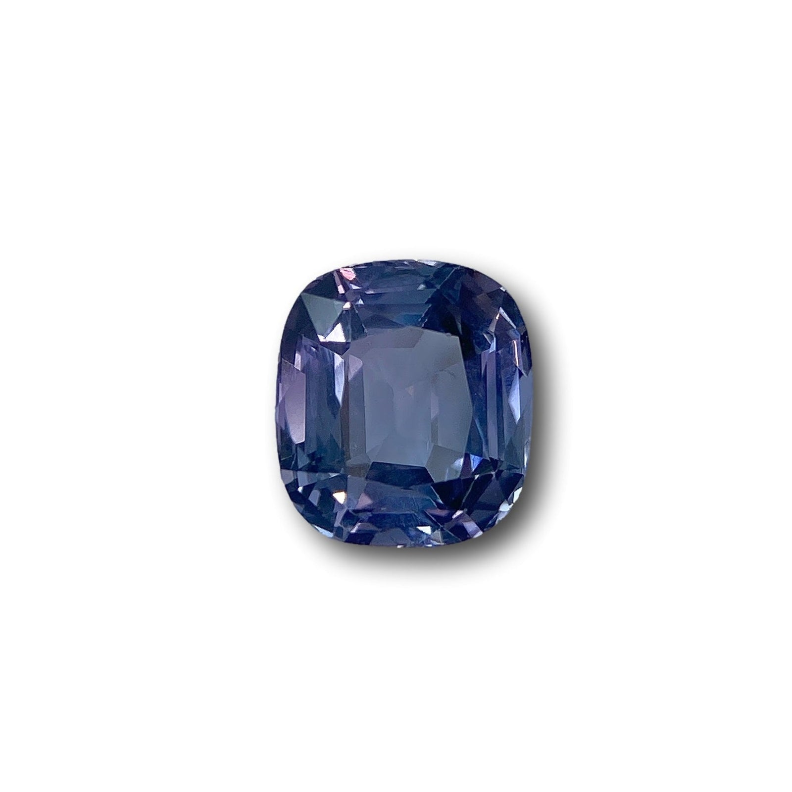 2.58ct cushion-cut purple spinel gemstone with a brilliant facet design, isolated on a white background.